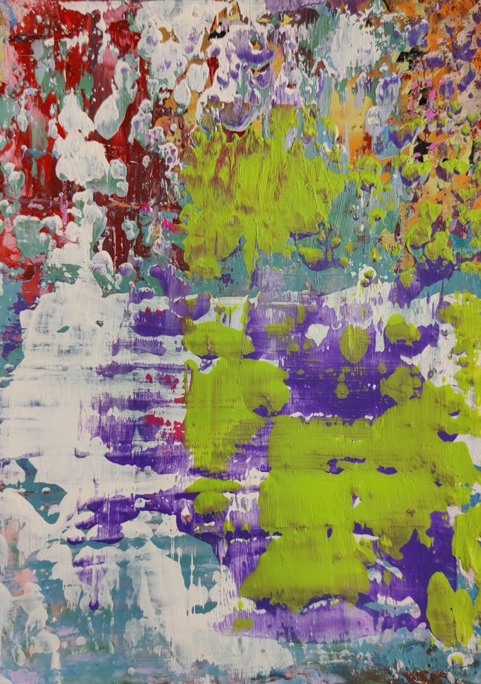 A lively abstract painting featuring vibrant colors and dynamic textures on canvas.