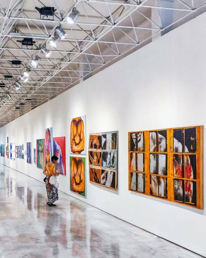 About Explore a contemporary art exhibition in a Brazilian gallery, showcasing vibrant modern artworks.